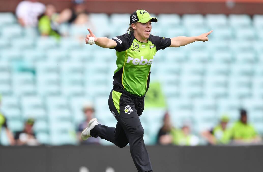Naomi Stalenberg celebrates taking a catch in the deep against the Sydney Sixers at the Sydney Cricket Ground on Saturday afternoon. Picture: AAP Image/David Moir