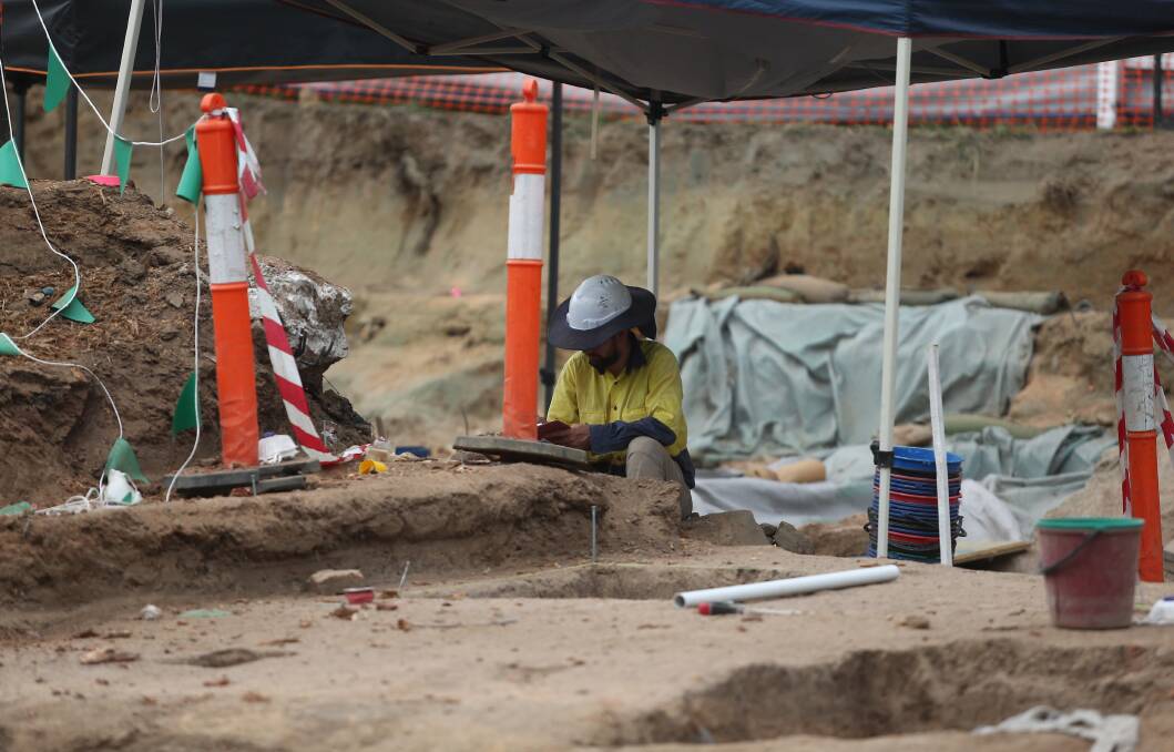 Heritage: A worker at the Thompson Square archaeological dig in January. Mr Frydenberg has written to Ms Berejiklian in relation to the project. Picture: Geoff Jones.