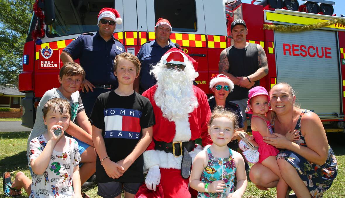 Santa Run: Richmond Fire and Rescue NSW members meet with locals at Harold Avenue and Laurence Street Playground Hobartville. Picture: Geoff Jones