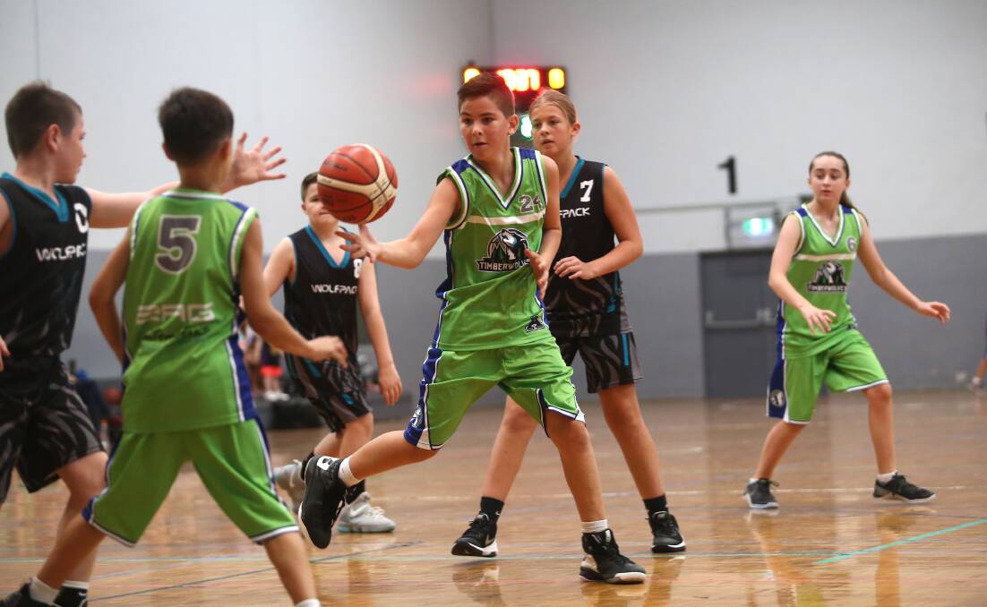 Harrison takes possession during the U14's mixed Div 2 Timberwolves V Wolf Pack match at Hawkesbury Indoor Stadium. Picture: Geoff Jones