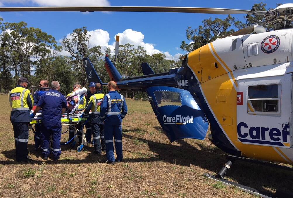 The girl is taken on board the CareFlight helicopter. Picture: CareFlight.