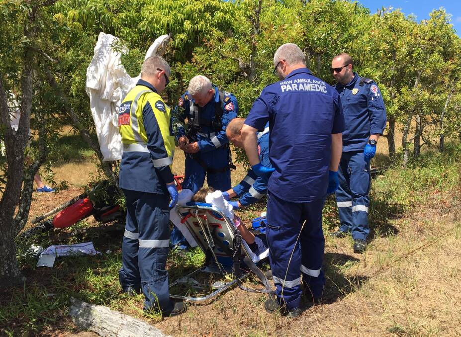 The girl is assisted by paramedics and the CareFlight crew at the scene. Picture: CareFlight.