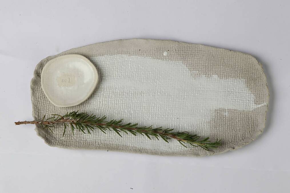 Tactile pleasure: Forget granny's china. Elegant, hand-thrown dishes are the new heirlooms. None better than this crinkle platter, $150, slabandslub.com.au, and "sel" (salt) dish, $25, mhceramics.net. Photo: Ben Rushton