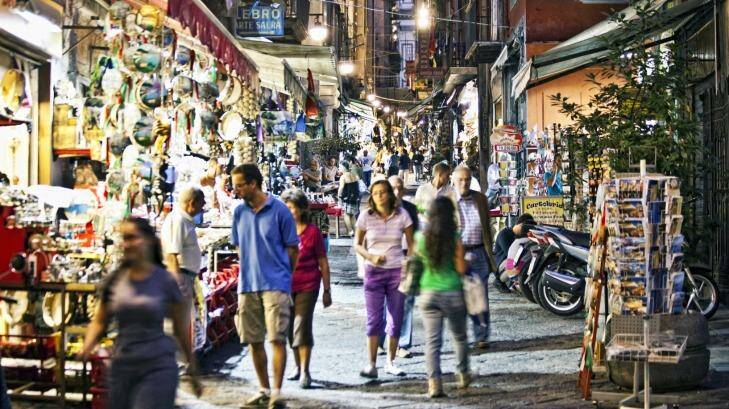 The tourist souvenir shops and cafes in the historical old town of Naples. Photo: iStock