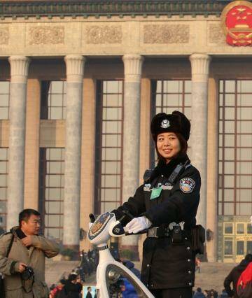Security guards patrol Tiananmen Square during the National People's Congress. Beijing knows that carefully choreographed set pieces for traditional media may fall flat with China's youth. Photo: Sanghee Liu