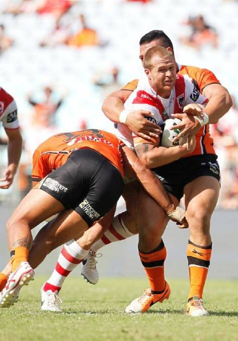 Digging in: Dragons forward Jack De Belin against Wests Tigers in round one. Photo: Christopher Chan