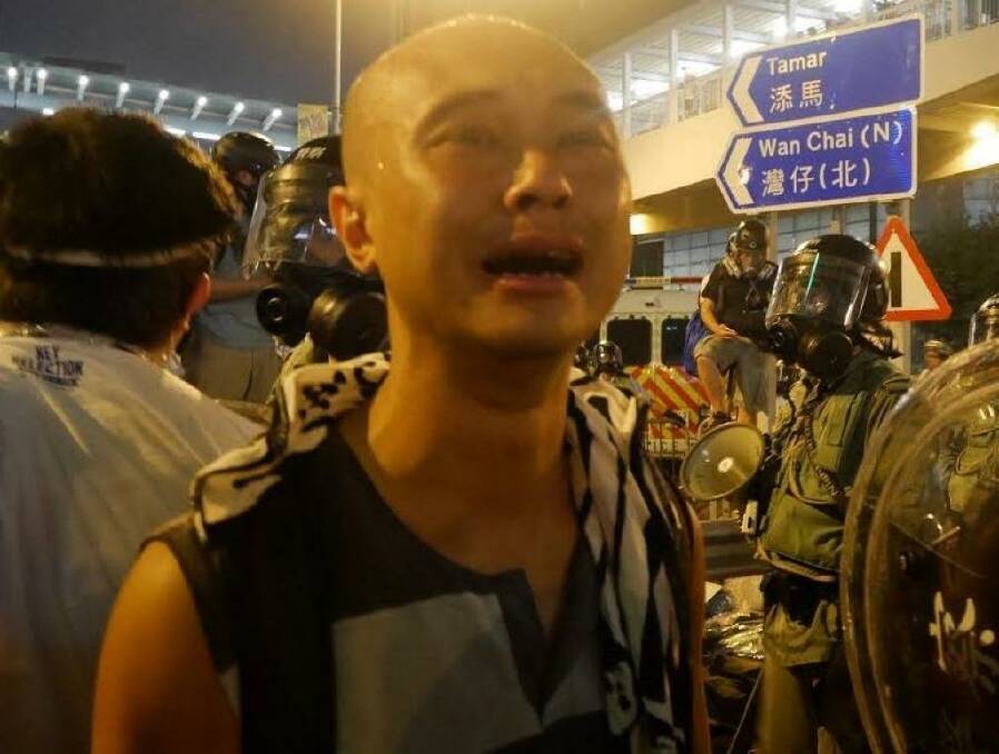30-year-old postgraduate student Leung Hei is overcome with emotion. Photo: Philip Wen