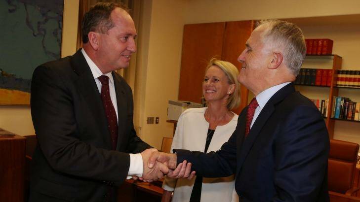 Prime Minister Malcolm Turnbull congratulates Deputy Prime Minister designate Barnaby Joyce and Deputy Nationals Leader Fiona Nash after the Nationals leadership ballot on Thursday night. Photo: Andrew Meares