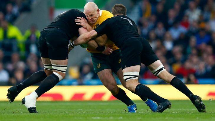 Captain crunched: Stephen Moore is tackled by Richie McCaw and Kieran Read. Photo: Mike Hewitt