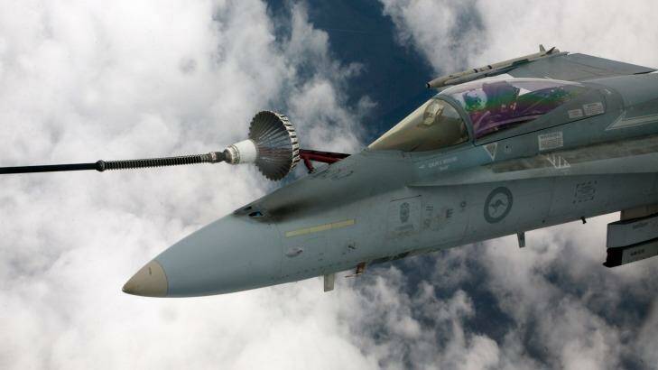 A RAAF Hornet refueling off a KC-30 tanker in a file picture. Photo: Mark Smith