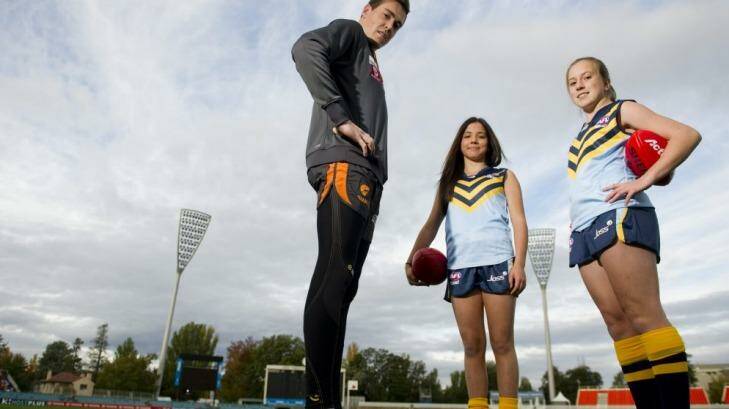 GWS Giants player Jeremy Cameron with ACT representatives for the National Championships Jessica Stramandinoli and Kaitlin Dobing. Photo: Jay Cronan
