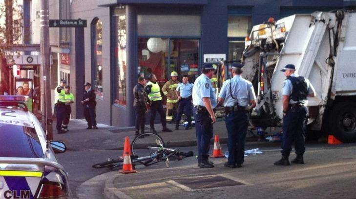 Cyclist trapped under a garbage truck in Surry Hills. Photo: John Ewart