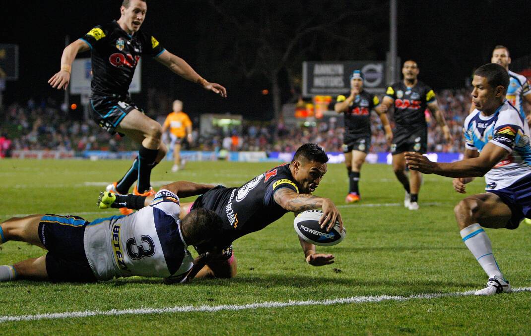 SYDNEY, AUSTRALIA - APRIL 21:  Dean Whare of the Panthers scores a try in the tackle of Maurice Blair during the round seven NRL match between the Penrith Panthers and the Gold Coast Titans at Sportingbet Stadium on April 21, 2014 in Sydney, Australia.  (Photo by Renee McKay/Getty Images)