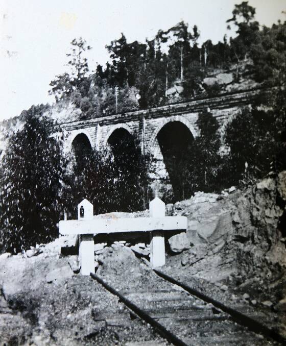 pic a=John Ward from The Nepean District Archeological Group [L] & John McPhee who has pictures of an old Knapsack signal cabin. pix bc=same with model of Zig Zag.pic d=Knapsack signal cabin.pic e=Rail Bridge. The old cabin is located on Zig Zag Bridge walkway.