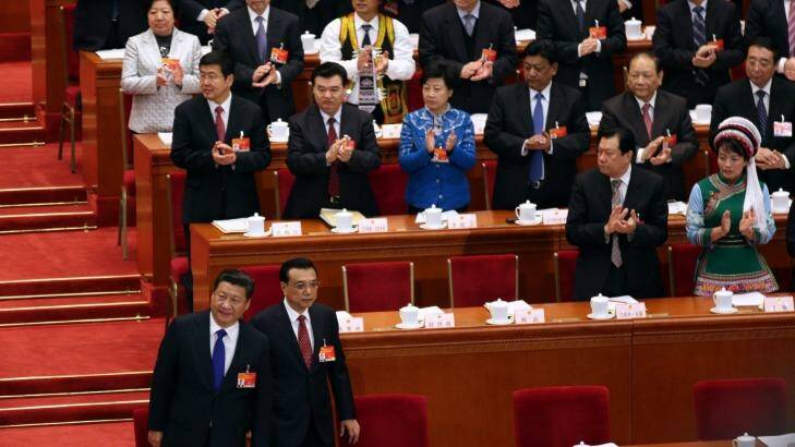 Members of the National People's Congress applaud as President Xi Jinping, front left, and Premier Li Keqiang, right, take their seats. Photo: Sanghee Liu