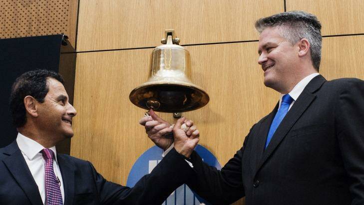 Medibank managing director George Savvides and Finance Minister Mathias Cormann at the ASX Medibank private listing ceremony. Photo: Christopher Pearce