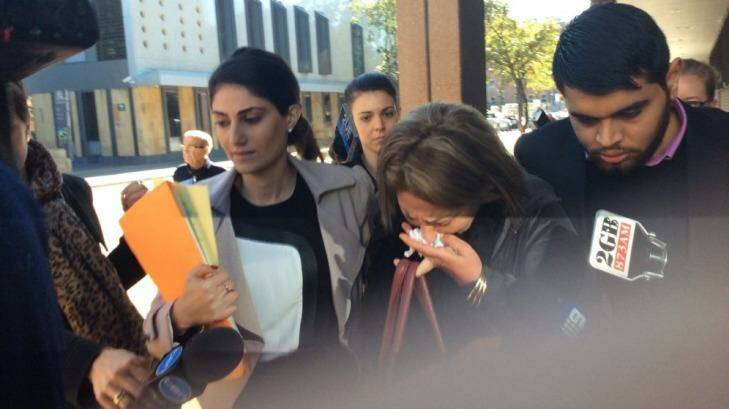 A distressed friend of Kazem Mohamadi Payam leaves court in tears. Photo: Emma Partridge