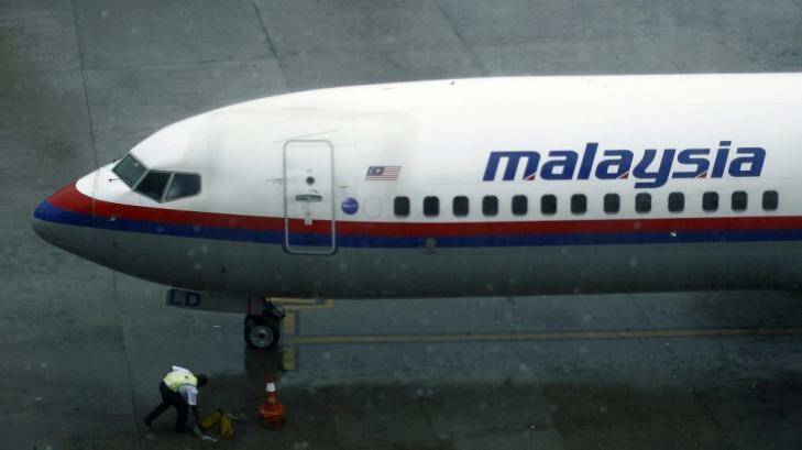 Safety considerations: A ground staff works near a Malaysia Airlines aircraft at the Kuala Lumpur International Airport this week.