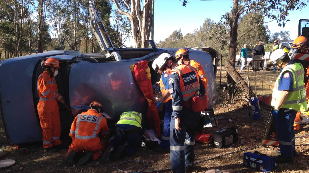 Emergency teams combine to release and treat the injured woman at Kurrajong today. Picture: CareFlight.