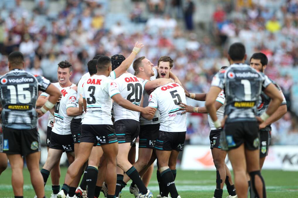 Glory: The Penrith Panthers under-20s celebrate their win over the New Zealand Warriors in the 2013 grand final. 
