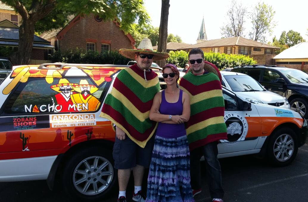 Down for the cause: Grant Watson and Dane Griffis with artist Tanya Malzard and their Ford Falcon. Photo: supplied.