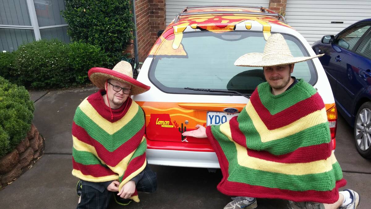 On a mission: The Nacho Men together with their car. Photo: supplied.