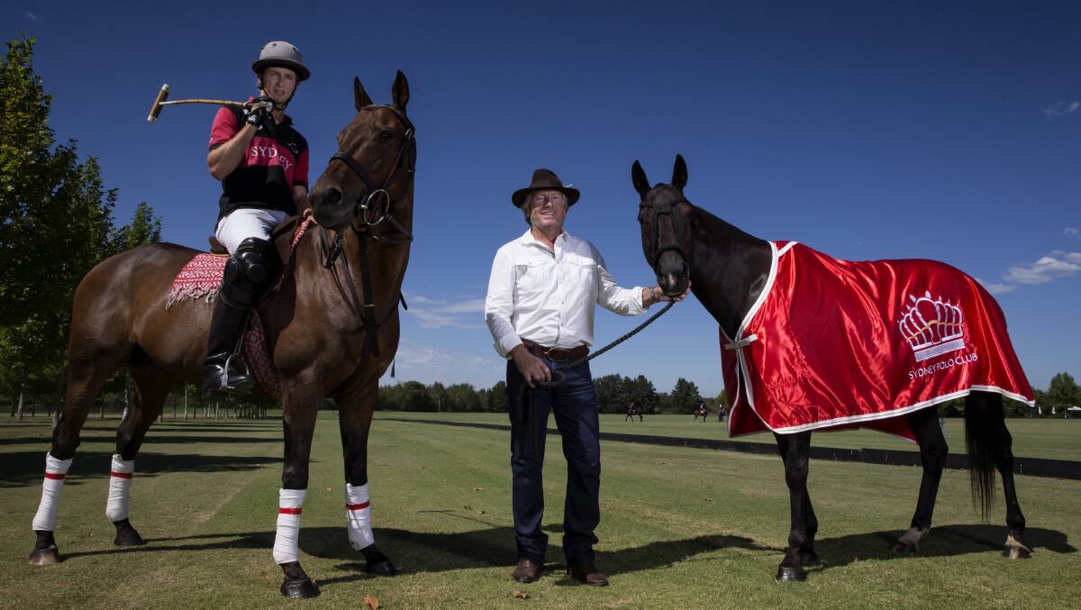 Gearing Up: Sydney Polo Club owner Peter Higgins (standing) with UK club Druids Lodge player Eden Ormerod. Picture: Geoff Jones. 