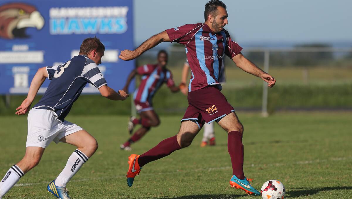 Hat-trick hero: Ahmed Khan on his way to three goals in Hawkesbury City's 7-0 FFA Cup win. Picture: Geoff Jones