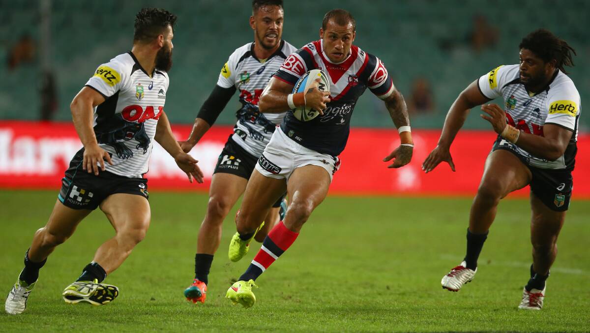 Try time: Roosters centre Blake Ferguson on his way to two tries against Penrith on Monday night. Picture: Mark Kolbe