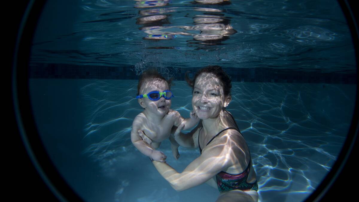 Swim safe year-round: Jacquie Rodney and son Beau, 1, don’t skip their swimming lessons in Richmond just because it’s winter.  Picture:  Geoff Jones