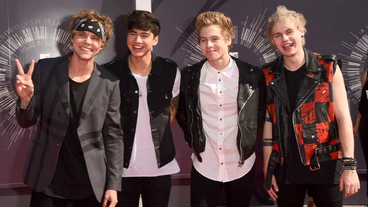 The band on the red carpet at the MTV VMA awards.