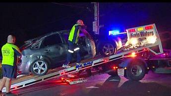 Vehicle being secured onto tilt tray tow truck. Picture: Top Notch 