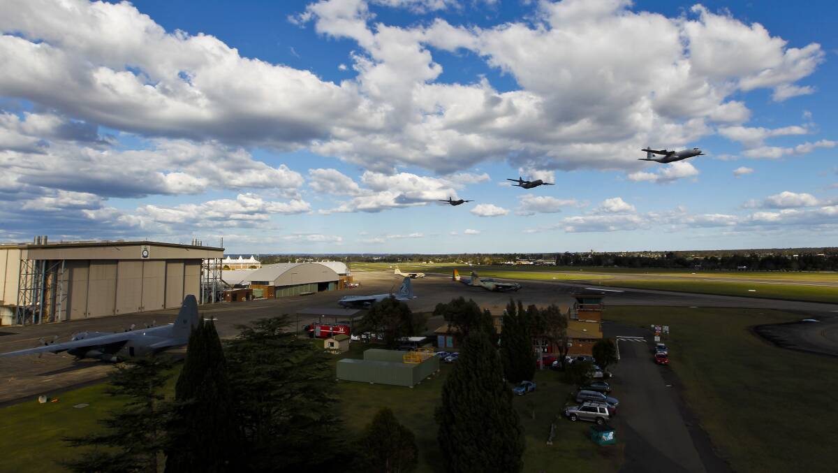 Flying high:  Three of the C-130Js perform a flyover of Richmond RAAF Base.   Picture: Defence Force