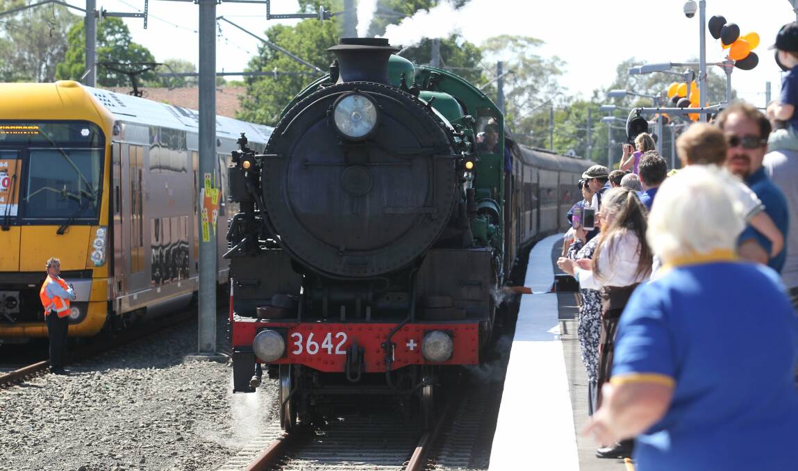 Crowds watch on as the 3642 steam train pulls into Richmond station. Pictures: Helen Nezdropa.