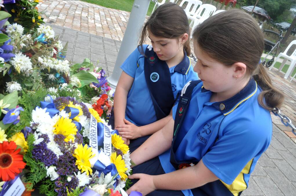 Kurrajong Girl Guides Matilda Brough and Katherine Thomas lay a wreath. Picture: Suzie Vlaming