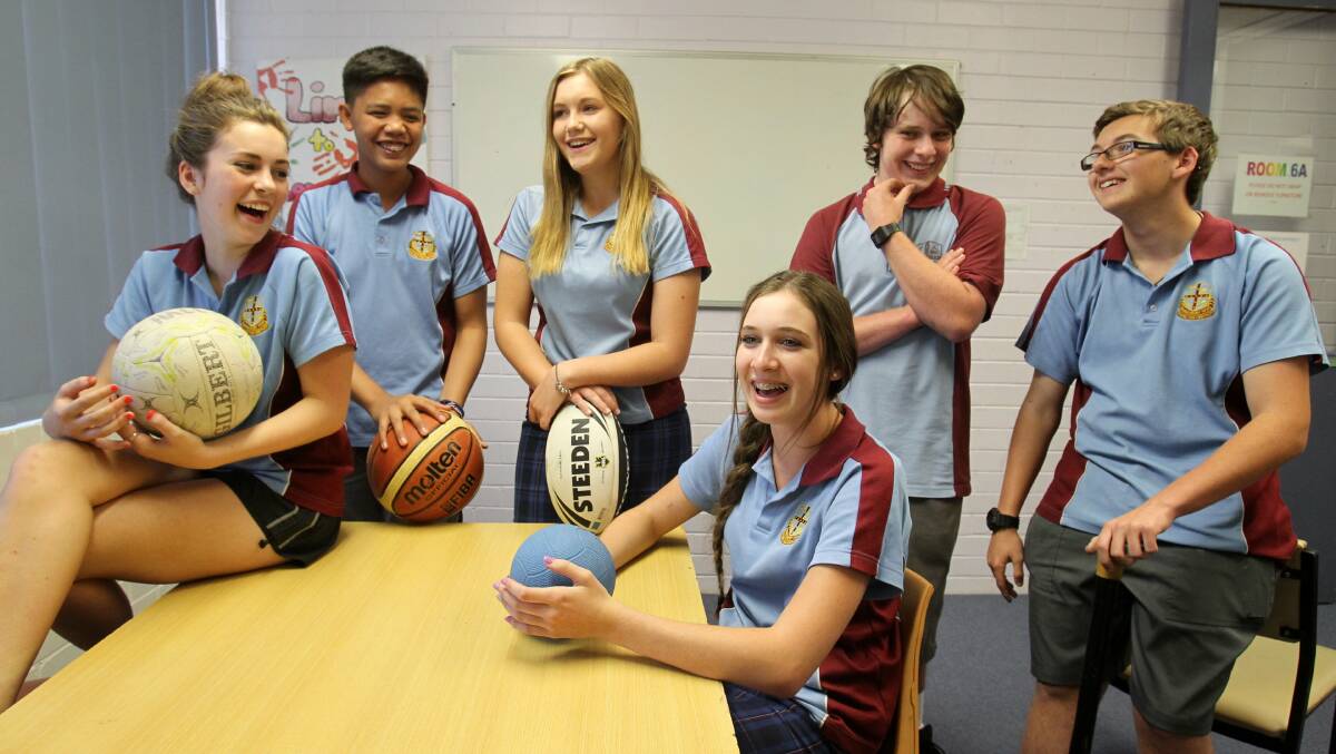 Ball in their court: Hawkesbury High School students Tanika Gauci, Mark Tarculas, Sarah Higginbotham, Krystal Williams, Tobias Kessler and Jack Arthur, talk about the best way to make a business out of sporting goods. Picture: Gene Ramirez