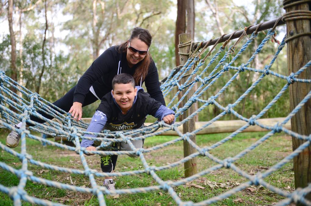 Weekend of achievements: Jahra Balgowan with her son Denzel, 11, at the YMCA Yarramundi Brainwave camp. Picture: Jeremy Piper