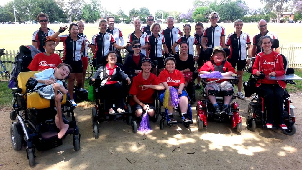 Some participants at Richmond Park with some beneficiaries of their ride. 