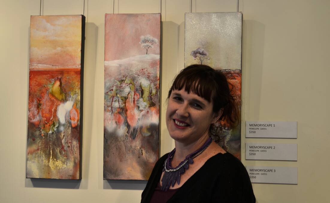 Artist Penny Oates with some of the artwork from her first solo exhibition.