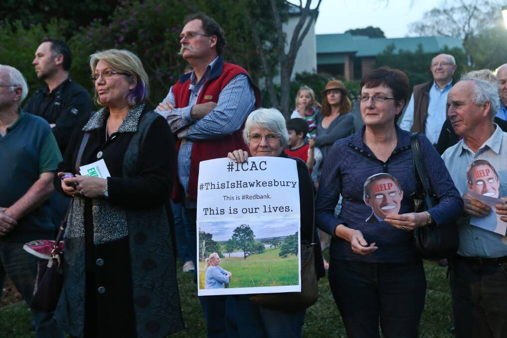 Hawkesbury residents rallied outside the council chambers last night to call for a freeze on any progress of the North Richmond development until the ICAC inquiry was complete. Pictures: Geoff Jones