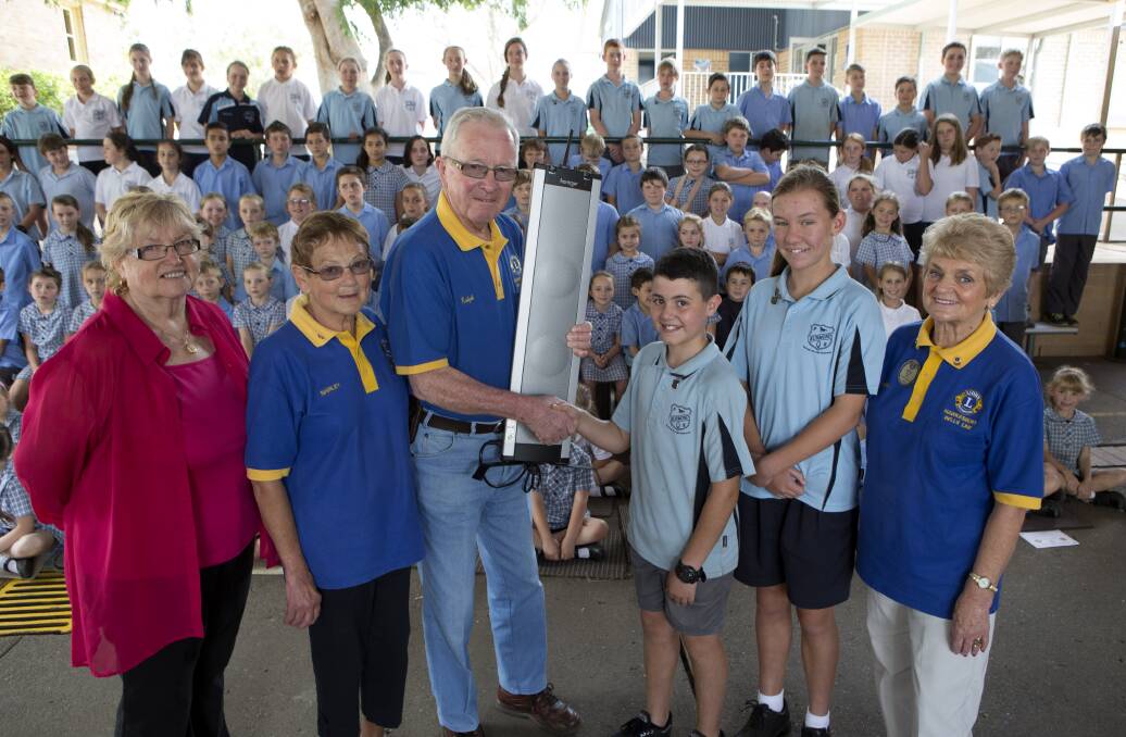 Changing teacher’s frequency: Kurmond Public School’s new sound system for hearing-impaired children with, from left, principal Elena Denton, Hawkesbury Bells Line Lions Club members Shirley and Ralph Scott, school captains Samuel Monteleone and Annalyse Garton, and Lions Club chair Beryl Payne. Picture: Geoff Jones
