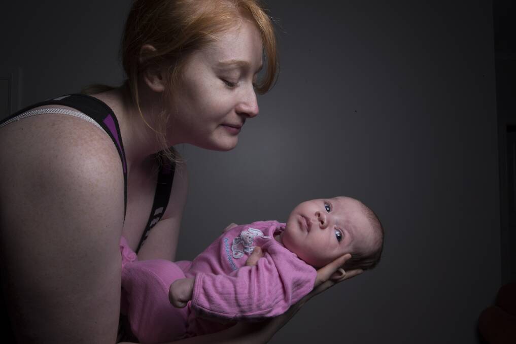 Survivor:  Jessica Chan at her Bowen Mountain home with baby Natasha. Picture: Geoff Jones
