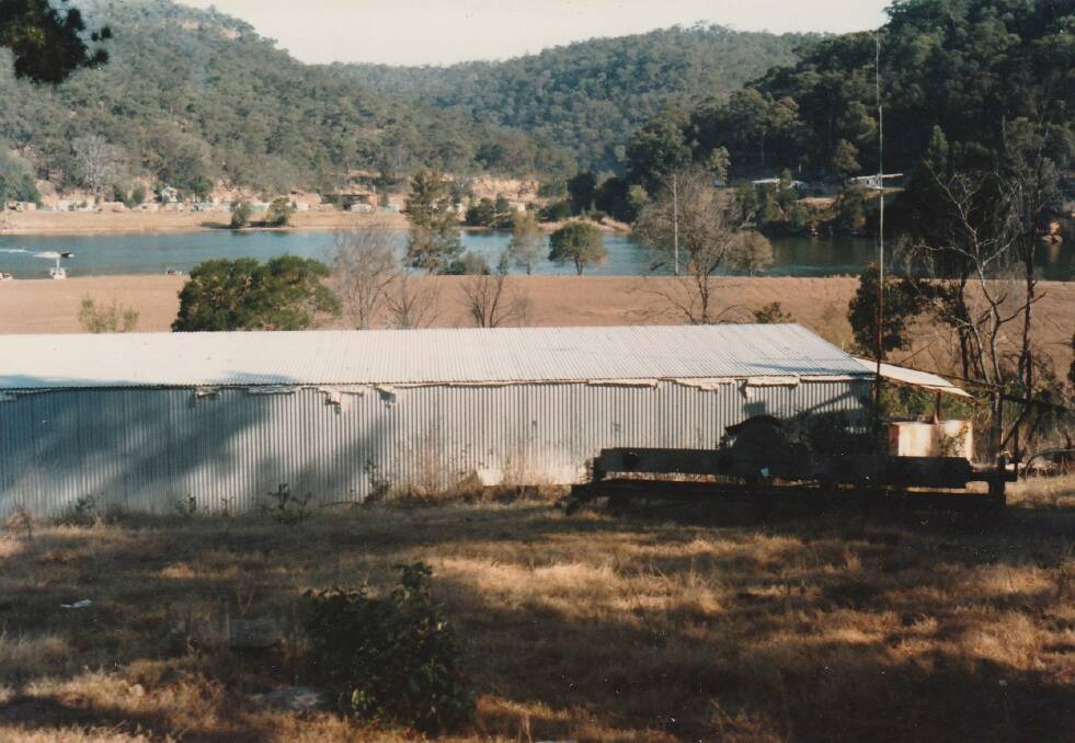 Australian Farm where the ketch was washed ashore in the 1867 flood. This is looking across to the south bank of the river to Leets Vale township with the church on left and former post office on right. The large shed is where the second school was built. The children were rowed across to it. The foreground is the site of the Chaselings orchard.