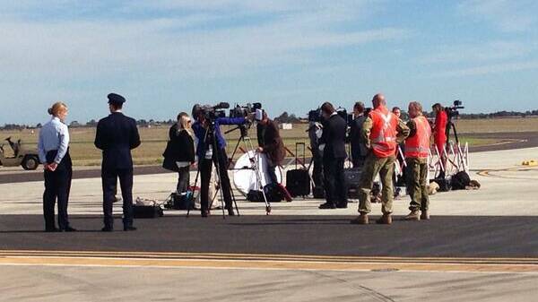 Media waits at the Edinburgh RAAF base for the Duke and Duchess of Cambridge to arrive.