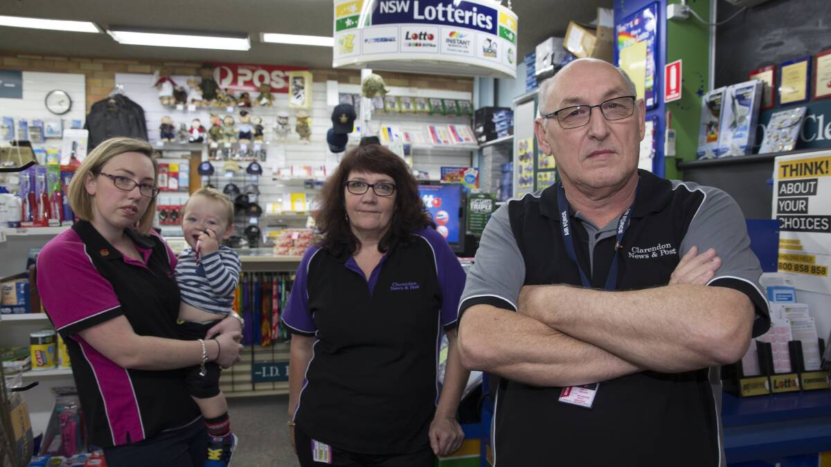 RAAF Newsagency and Post Office licensee Trevor Smith with his wife Linda, daughter Rachel and grandson Zachary at the Richmond base.  
Picture: Geoff Jones
