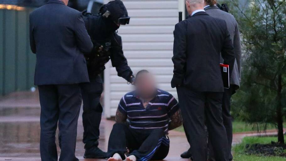 The President of the Rebels Windsor Chapter has been arrested at his home in Kingswood on Friday.
He was charged with the murder of a man on the Central Coast last year. Photo: Police Media