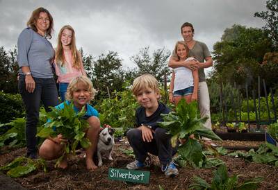 Andrew Brown and Anna Addicoat with their children Tiger 12, Angel 12, Lucien 9, Eli 6 and dog Ranger at their Windsor Downs organic farm and home. Photo: Geoff Jones .