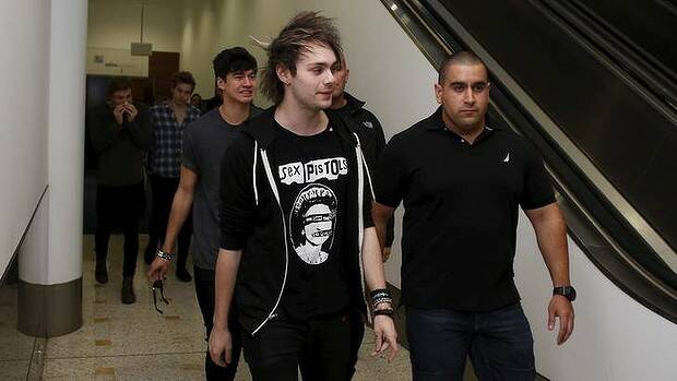 5 Seconds of Summer's Michael Clifford arrives at Sydney Airport on Monday morning. Photo: Daniel Munoz
