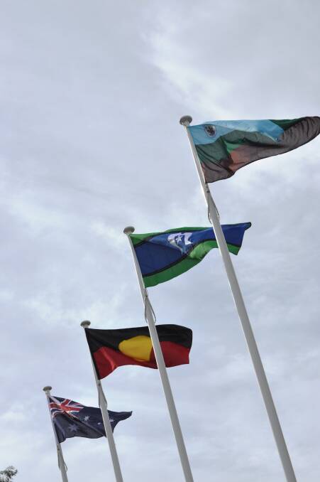 The two flags in the middle are the traditional Torres Strait Islander and Aboriginal flags. 