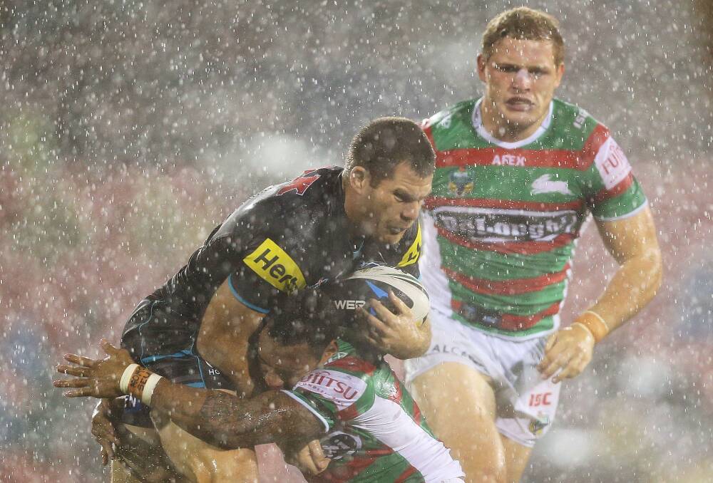 SYDNEY, AUSTRALIA - APRIL 11: Kevin Kingston of the Panthers is tackled during the round 6 NRL match between the Penrith Panthers and the South Sydney Rabbitohs at Sportingbet Stadium on April 11, 2014 in Sydney, Australia. (Photo by Mark Metcalfe/Getty Images)